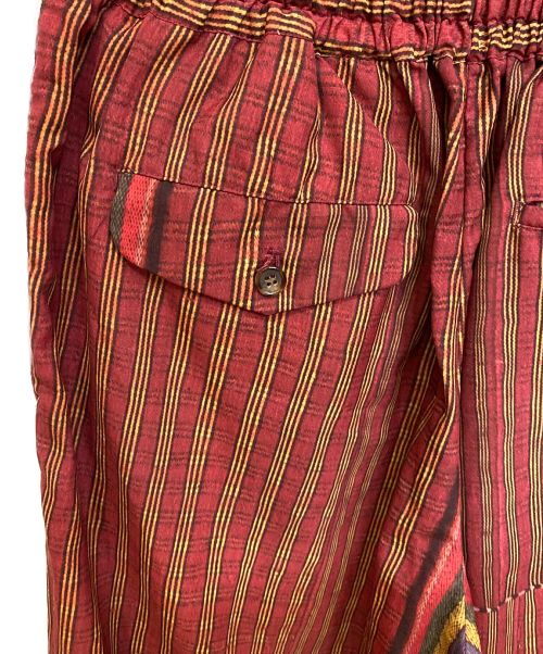 COMME des GARCONS HOMME PLUS（コムデギャルソンオムプリュス）COMME des GARCONS HOMME PLUS (コムデギャルソンオムプリュス) 92SS エスニック期 転写プリントワイドパンツ/Archive レッド×イエロー サイズ:Mの古着・服飾アイテム
