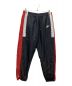 NIKE（ナイキ）の古着「WOVEN RE ISSUE PANT」｜ブラック×レッド