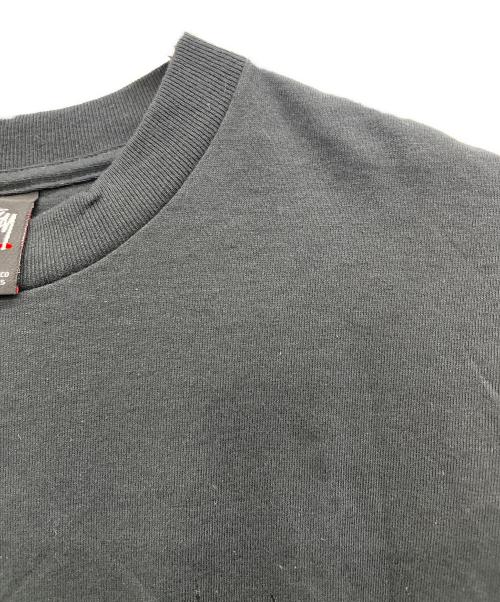 stussy（ステューシー）stussy (ステューシー) NEXUSVII (ネクサスセブン) プリントTシャツ ブラック サイズ:Mの古着・服飾アイテム
