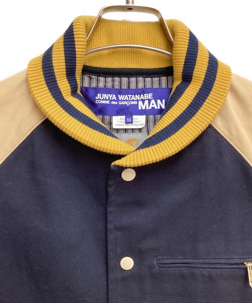 COMME des GARCONS JUNYA WATANABE MAN（コム デ ギャルソン ジュンヤ ワタナベ マン）COMME des GARCONS JUNYA WATANABE MAN (コム デ ギャルソン ジュンヤ ワタナベ マン) CarHartt (カーハート) VARSITY JACKET(ヴァーシティジャケット) ネイビー サイズ:XSの古着・服飾アイテム