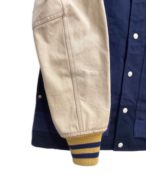COMME des GARCONS JUNYA WATANABE MAN（コム デ ギャルソン ジュンヤ ワタナベ マン）COMME des GARCONS JUNYA WATANABE MAN (コム デ ギャルソン ジュンヤ ワタナベ マン) CarHartt (カーハート) VARSITY JACKET(ヴァーシティジャケット) ネイビー サイズ:XSの古着・服飾アイテム