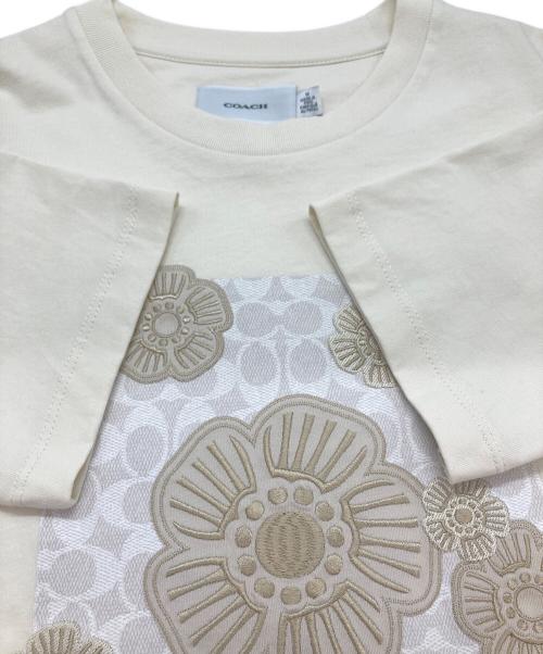 COACH（コーチ）COACH (コーチ) ティー ローズ Tシャツ アイボリー サイズ:Mの古着・服飾アイテム