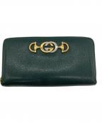 GUCCIグッチ）の古着「ラウンドファスナー財布」｜グリーン