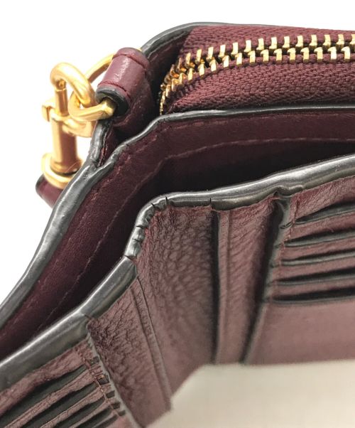 TORY BURCH（トリーバーチ）TORY BURCH (トリーバーチ) 2つ折り財布 ボルドーの古着・服飾アイテム