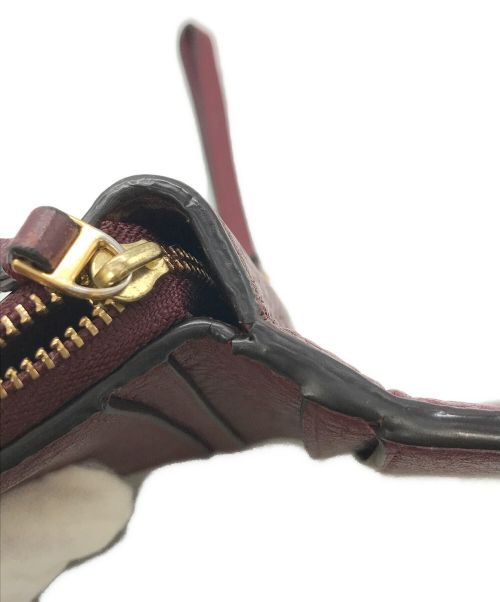 TORY BURCH（トリーバーチ）TORY BURCH (トリーバーチ) 2つ折り財布 ボルドーの古着・服飾アイテム