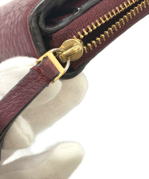 TORY BURCH（トリーバーチ）TORY BURCH (トリーバーチ) 2つ折り財布 ボルドーの古着・服飾アイテム