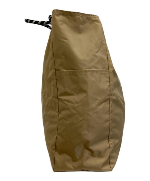 NOMADIS（ノマディス）NOMADIS (ノマディス) ナイロントートバッグ ベージュの古着・服飾アイテム