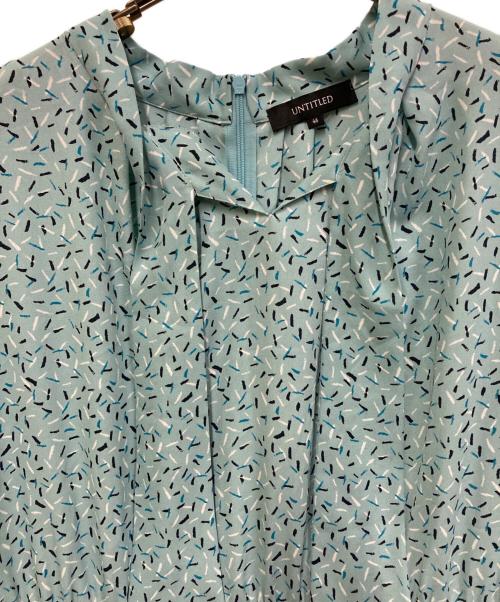 UNTITLED（アンタイトル）UNTITLED (アンタイトル) フェザープリント ボウタイワンピース スカイブルー サイズ:46の古着・服飾アイテム