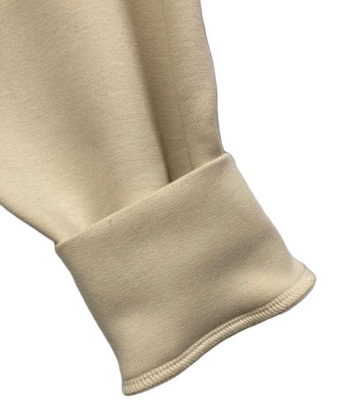 UNFILO（アンフィーロ）UNFILO (アンフィーロ) BEAUTY FORM JERSEY バックZIPプルオーバー ベージュ サイズ:Mの古着・服飾アイテム