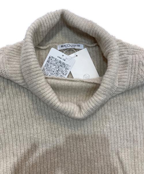 BEAUTY&YOUTH（ビューティーアンドユース）BEAUTY&YOUTH (ビューティーアンドユース) ボリュームスリーブ タートルネック ニットプルオーバー ベージュ サイズ:Free 未使用品の古着・服飾アイテム