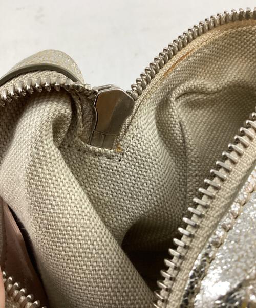 JIMMY CHOO（ジミーチュウ）JIMMY CHOO (ジミーチュウ) スタースタッズポーチ ゴールドの古着・服飾アイテム