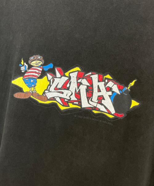 SANTAMONICA AIRLINES（サンタモニカエアライン）SANTAMONICA AIRLINES (サンタモニカエアライン) プリントTシャツ ブラック サイズ:不明の古着・服飾アイテム