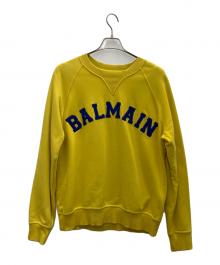BALMAIN（バルマン）の古着「Universityロゴ スウェット」｜イエロー
