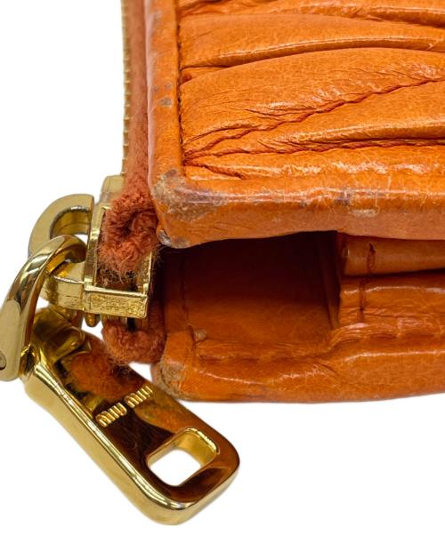 MIU MIU（ミュウミュウ）MIU MIU (ミュウミュウ) マテラッセL字ファスナー長財布 オレンジの古着・服飾アイテム