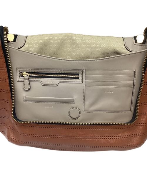 ANYA HINDMARCH（アニヤ・ハインドマーチ）ANYA HINDMARCH (アニヤハインドマーチ) 2WAYバッグ/カットワーク マキシジップ サッチェル ブラウンの古着・服飾アイテム