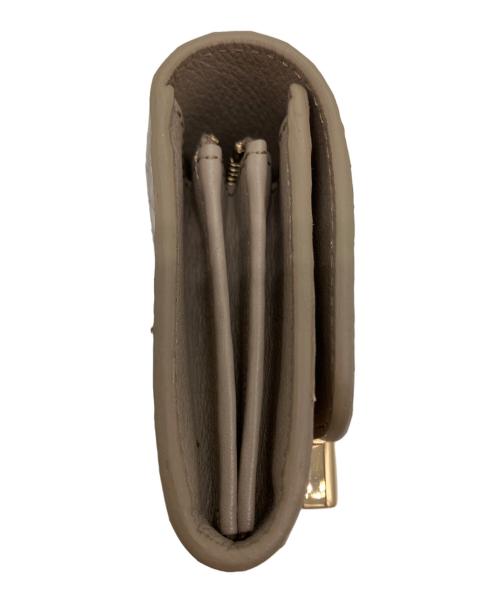 TOD'S（トッズ）TOD'S (トッズ) ダブルTパイソンウォレットの古着・服飾アイテム