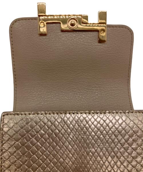 TOD'S（トッズ）TOD'S (トッズ) ダブルTパイソンウォレットの古着・服飾アイテム