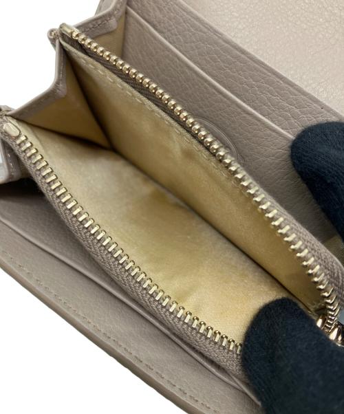 TOD'S（トッズ）TOD'S (トッズ) ダブルTパイソンウォレットの古着・服飾アイテム