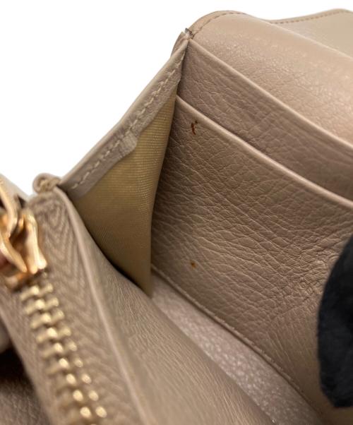 TOD'S（トッズ）TOD'S (トッズ) ダブルTパイソンウォレットの古着・服飾アイテム