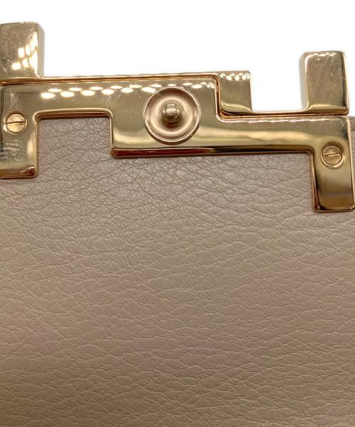 TOD'S（トッズ）TOD'S (トッズ) ダブルTパイソンウォレットの古着・服飾アイテム