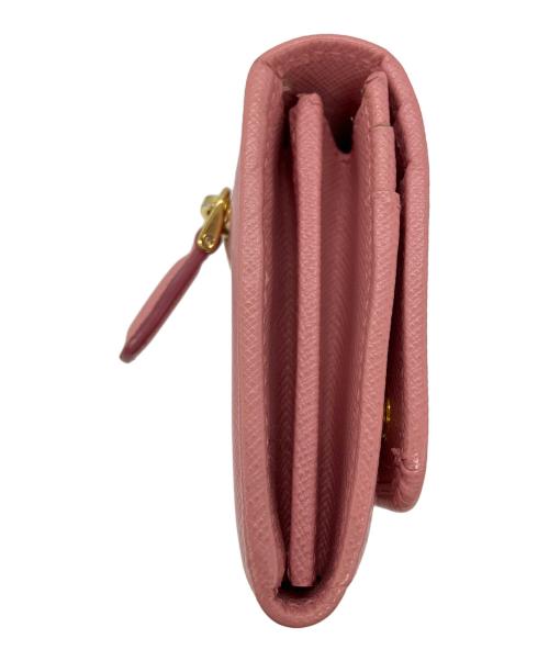 PRADA（プラダ）PRADA (プラダ) リボンZIP長財布　サフィアーノ ピンクの古着・服飾アイテム