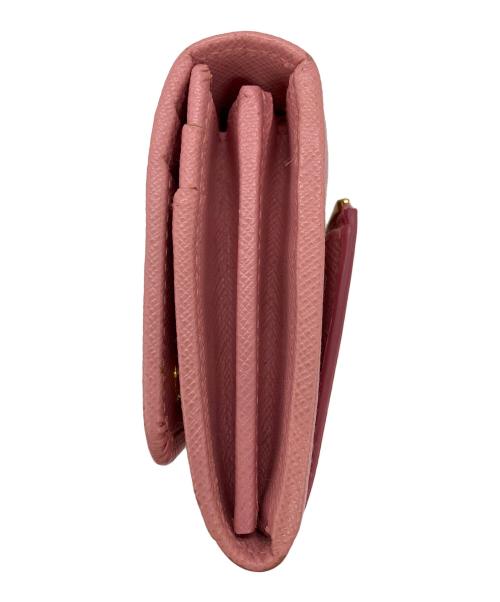 PRADA（プラダ）PRADA (プラダ) リボンZIP長財布　サフィアーノ ピンクの古着・服飾アイテム