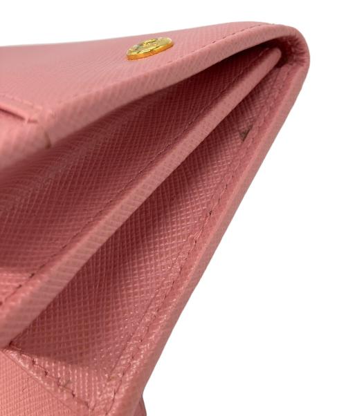 PRADA（プラダ）PRADA (プラダ) リボンZIP長財布　サフィアーノ ピンクの古着・服飾アイテム