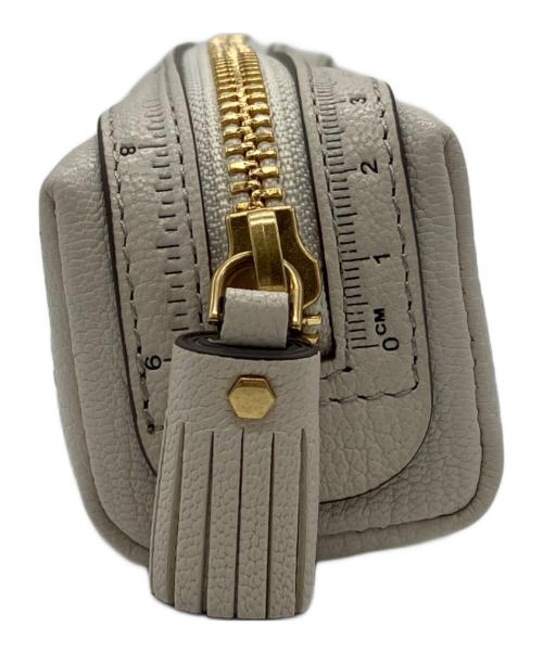 ANYA HINDMARCH（アニヤ・ハインドマーチ）ANYA HINDMARCH (アニヤ・ハインドマーチ) オールオーバーステッカー ペンケース ベージュの古着・服飾アイテム