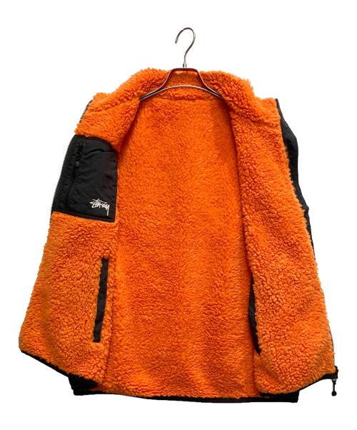 stussy（ステューシー）stussy (ステューシー) Sherpa Reversible VEST ブラック×オレンジ サイズ:Lの古着・服飾アイテム