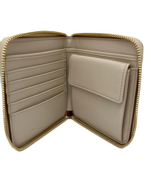 STELLA McCARTNEY（ステラマッカートニー）STELLA McCARTNEY (ステラマッカートニー) ラウンドファスナー財布　ラウンドファスナー パンチング ステラロゴ ベージュの古着・服飾アイテム