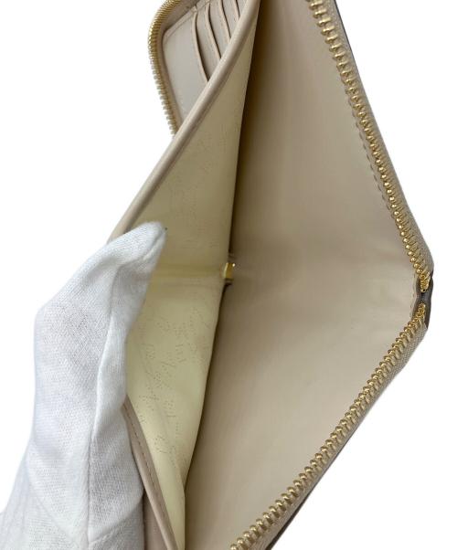 STELLA McCARTNEY（ステラマッカートニー）STELLA McCARTNEY (ステラマッカートニー) ラウンドファスナー財布　ラウンドファスナー パンチング ステラロゴ ベージュの古着・服飾アイテム