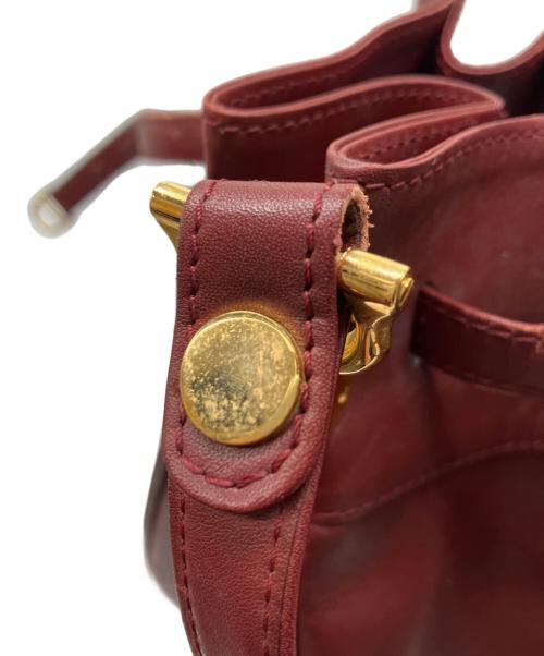 Cartier（カルティエ）Cartier (カルティエ) 巾着ショルダーバッグ ボルドーの古着・服飾アイテム