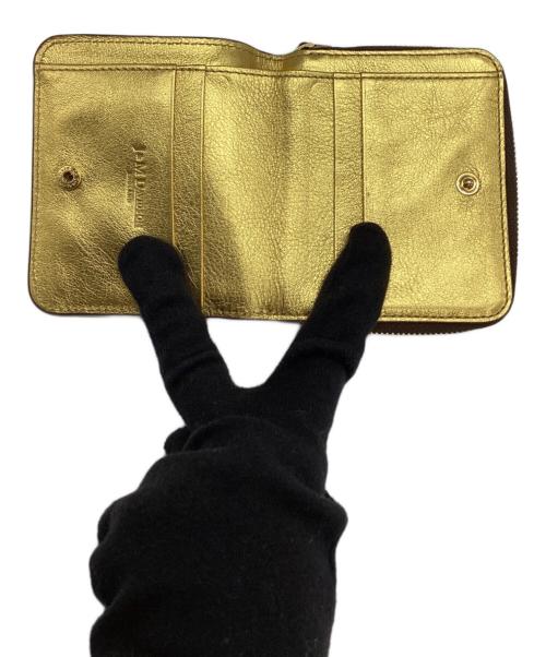J&M DAVIDSON（ジェイ＆エム デヴィッドソン）J&M DAVIDSON (ジェイ＆エム デヴィッドソン) ラウンドファスナー財布 ゴールドの古着・服飾アイテム