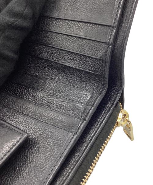 Yves Saint Laurent（イヴサンローラン）Yves Saint Laurent (イヴサンローラン) 2つ折り財布 ブラックの古着・服飾アイテム