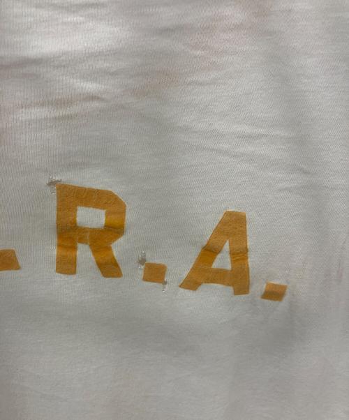 Champion（チャンピオン）Champion (チャンピオン) 染み込みプリント リンガーTシャツ　 60s プロダクツタグ ホワイト×イエロー サイズ:XLの古着・服飾アイテム