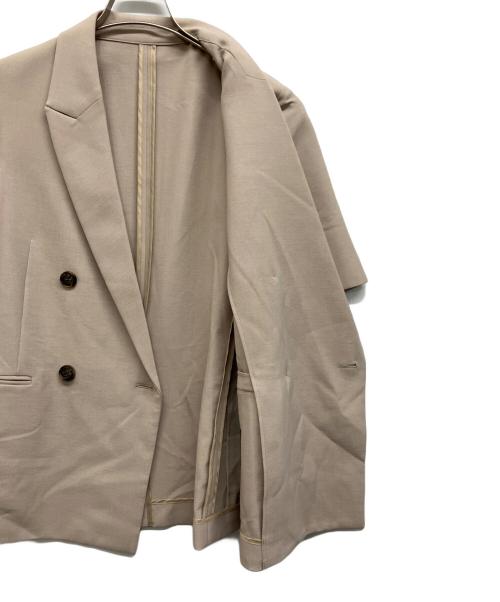 uncrave（アンクレイヴ3.）uncrave (アンクレイヴ3.) ウォッシャブルドライサップハーフスリーブジャケット ベージュの古着・服飾アイテム