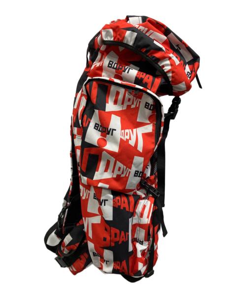 Gosha Rubchinskiy（ゴーシャラブチンスキー）Gosha Rubchinskiy (ゴーシャラブチンスキー) 総柄リュック レッドの古着・服飾アイテム