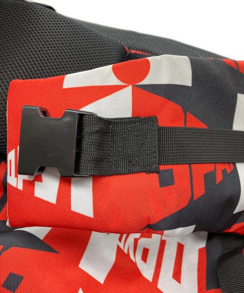 Gosha Rubchinskiy（ゴーシャラブチンスキー）Gosha Rubchinskiy (ゴーシャラブチンスキー) 総柄リュック レッドの古着・服飾アイテム