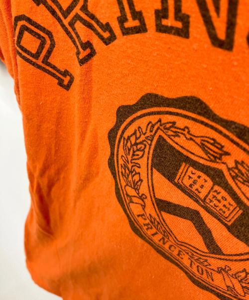 Champion（チャンピオン）Champion (チャンピオン) カレッジロゴtシャツ オレンジ サイズ:Mの古着・服飾アイテム