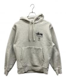 stussy（ステューシー）の古着「WORLD TOUR HOODIE」｜ライトグレー