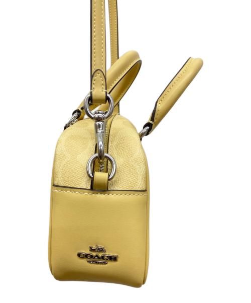 COACH（コーチ）COACH (コーチ) PEANUTS (ピーナッツ) サッチェル クロスボディ バッグ イエローの古着・服飾アイテム