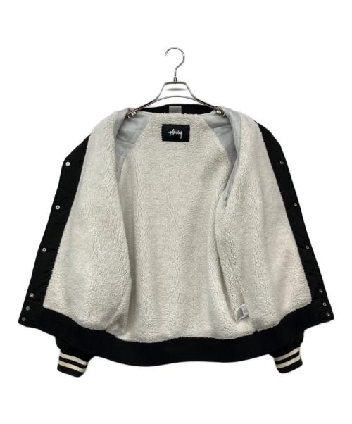 Champion（チャンピオン）Champion (チャンピオン) stussy (ステューシー) ロゴナイロンスタジャン ブラック サイズ:Mの古着・服飾アイテム