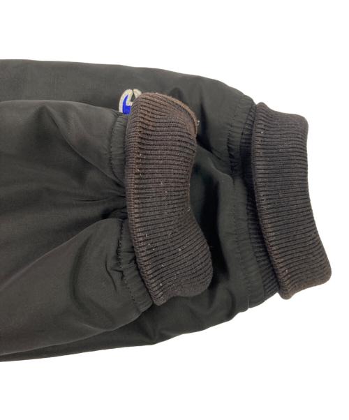 Champion（チャンピオン）Champion (チャンピオン) stussy (ステューシー) ロゴナイロンスタジャン ブラック サイズ:Mの古着・服飾アイテム