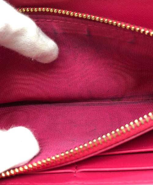 Dior（ディオール）DIOR (ディオール) チャーム付長財布 ショッキングピンクの古着・服飾アイテム