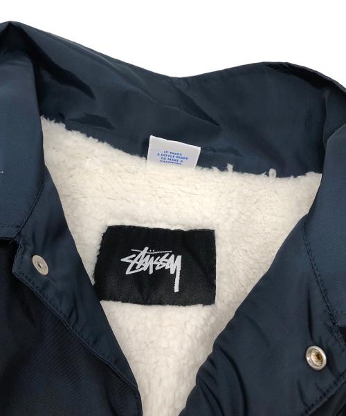 stussy（ステューシー）stussy (ステューシー) Champion (チャンピオン) 裏ボアコーチジャケット ネイビー サイズ:XLの古着・服飾アイテム