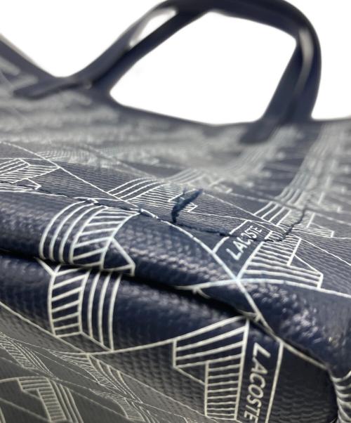 LACOSTE（ラコステ）LACOSTE (ラコステ) ゼリィ コーテッドキャンバスモノグラムスモールトート ネイビーの古着・服飾アイテム