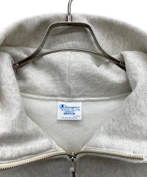 FRAMeWORK（フレームワーク）FRAMeWORK (フレームワーク) Champion (チャンピオン) 別注REVERSE WEAVE11.5OZフードハーフジップドロストプルオーバー オートミール サイズ:M 未使用品の古着・服飾アイテム