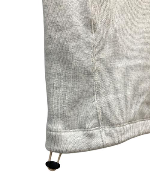 FRAMeWORK（フレームワーク）FRAMeWORK (フレームワーク) Champion (チャンピオン) 別注REVERSE WEAVE11.5OZフードハーフジップドロストプルオーバー オートミール サイズ:M 未使用品の古着・服飾アイテム