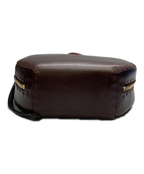 HENRY BEGUELIN（エンリーベグリン）HENRY BEGUELIN (エンリーベグリン) レザーラウンドバッグ　HENRY BEGUELIN レッド×ブラウンの古着・服飾アイテム