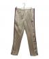 Needles（ニードルズ）の古着「Narrow Track Pant」｜ベージュ×ピンク